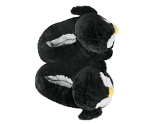 Load image into Gallery viewer, Pair of plush penguin slippers seen from above, on a white background