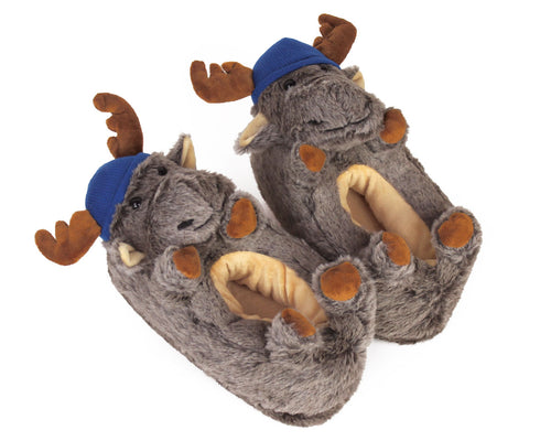Pair of moose slippers wearing little blue knit caps, with antlers, hooves, floppy ears, and smiling faces