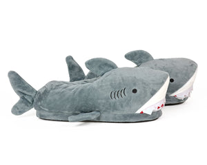 Side view of pair of plush shark slippers