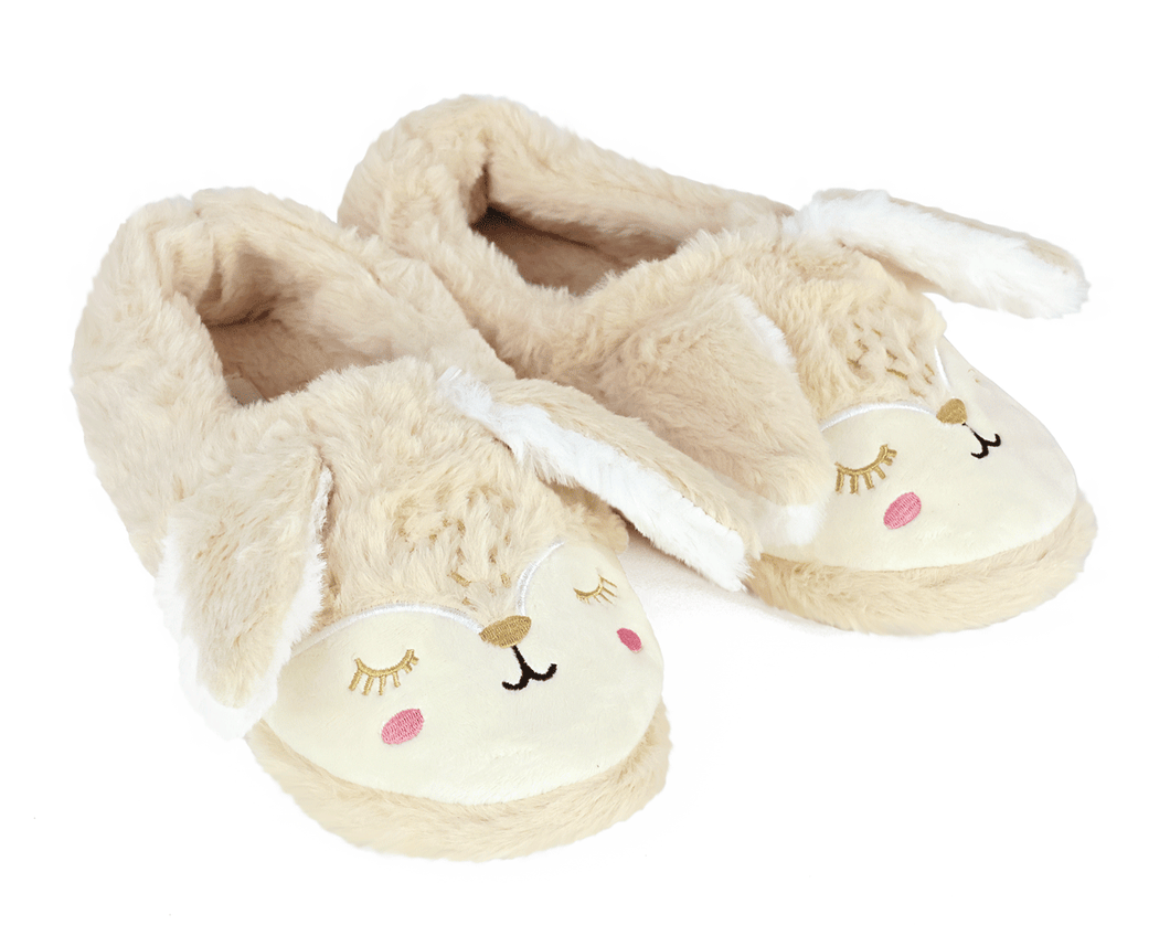 Pair of beige bunny slippers with embroidered faces and long ears on a white background